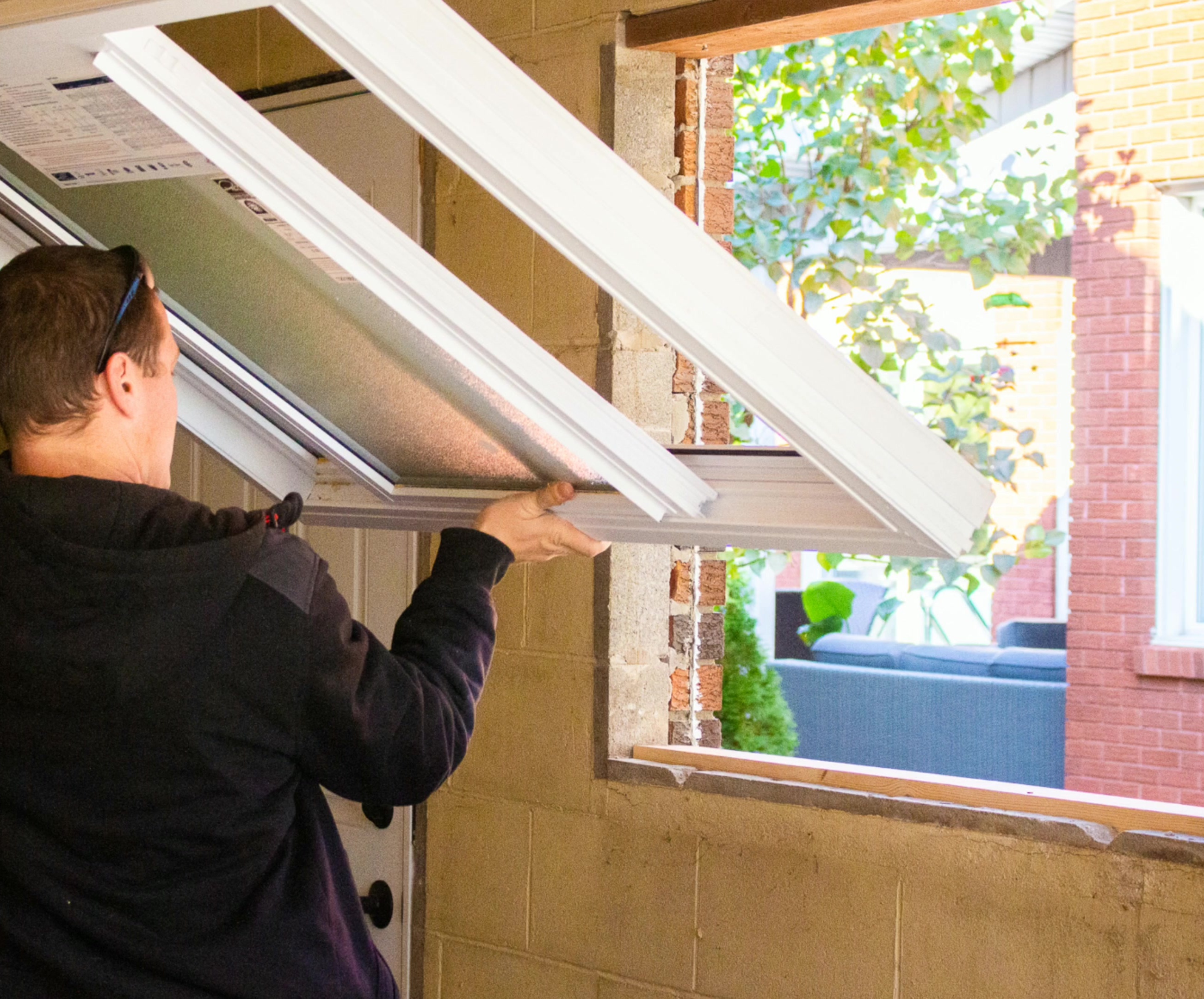 A worker installing a window